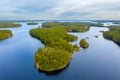 Aerial view of of small islands on a blue lake Saimaa. Landscape with drone. Blue lakes, islands and green forests from above on a Royalty Free Stock Photo