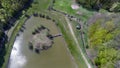 Aerial view about a small lake with a beautiful shaped island in Sarlos, Hungary