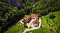 Aerial view of small monastery Vratna in Serbia under the big stone Royalty Free Stock Photo