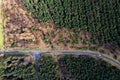 Aerial view on a small narrow road in a green forest. Country side. Drive through a woodland area Royalty Free Stock Photo