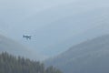 Aerial view of a small private airplane flying in the mountains Royalty Free Stock Photo