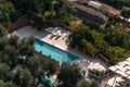 Aerial view of small rectangle swimming pool in olive trees, Italy, travel vacation concept