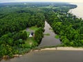 The aerial view of a small river, green trees and a white beach near Rock Point, Maryland, U.S