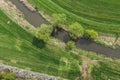 Aerial view of the small river and the harvest field Royalty Free Stock Photo