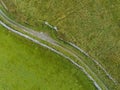 Aerial view small road in mountains, rock texture and stone fences, Burren, Ireland Royalty Free Stock Photo