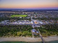 Aerial view of small shopping centre in Seaford and Nepean Highway at dusk. Melbourne, Victoria, Australia. Royalty Free Stock Photo