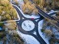 Aerial view of a small, snowy roundabout traffic circle Royalty Free Stock Photo