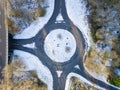 Aerial view of a small, snowy roundabout traffic circle Royalty Free Stock Photo