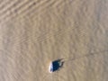 Aerial view of a small touristic motor boat sailing in the green water of Tagus river near Lisbon Marina harbour, Lisbon, Portugal Royalty Free Stock Photo