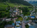 Aerial view of the small town of Mestia situated on a lush hillside in Georgia