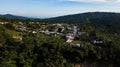 Aerial view on a small town in the mountainous tropical rainforest