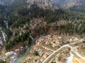 Aerial view of a small town surrounded by mountains.