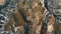 Aerial view of small vegetable fields between the craggy cliffs