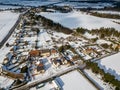 Aerial view of a small village in the British countryside during a rare heavy snowfall known as the beast from the east