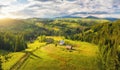 Aerial view of small village in Carpathian mountains at sunset Royalty Free Stock Photo