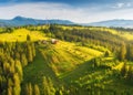 Aerial view of small village in Carpathian mountains at sunset Royalty Free Stock Photo