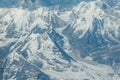 Aerial view of snow capped Himalayan mountains and glaciers on the flight from Tibet to Nepal. Royalty Free Stock Photo