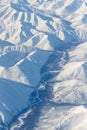 Aerial view of snow-capped mountains and river
