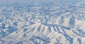 Aerial view of snow-capped mountains and river.