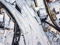 Aerial view of snow compromised rail and road networks.