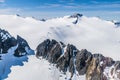 An aerial view of snow covered amountains and rocky walls above the Denver glacier close to Skagway, Alaska Royalty Free Stock Photo