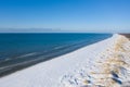 Aerial view of snow covered beach and dunes and blue calm sea Royalty Free Stock Photo