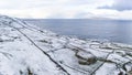 Aerial view of snow covered Dunmore Head, Bunaninver and Lackagh by Portnoo in County Donegal, Ireland.