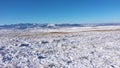 Aerial view of snow covered hills and mountain in the winter