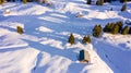 Aerial view of snow covered houses in small rural town in Switzerland Royalty Free Stock Photo