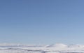 Aerial view snow covered mountains. Snowy mountain ridge on winter sunrise. Stunning mountains range covered with snow Royalty Free Stock Photo