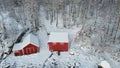 Aerial view of snow covered red buildings in Hamaroy