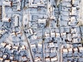 Aerial view of snowed in traditional housing suburbs in England.