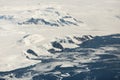 Aerial view of the snowy ice-covered landmass in Antarctica