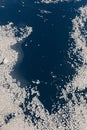 Aerial view of the snowy ice-covered landmass in Antarctica