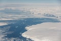 Aerial view of the snowy ice-covered landmass in Antarctica