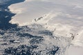 Aerial view of the snowy ice-covered landmass in Antarctica Royalty Free Stock Photo