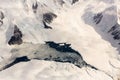 Aerial view of the snowy ice-covered mountains and frozen water in Antarctica Royalty Free Stock Photo