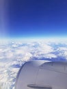 Awe-Inspiring Aerial View of Snowy Landscape Through Plane Window Royalty Free Stock Photo