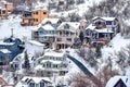 Aerial view of snowy neighborhood in winter on a mountain town with houses Royalty Free Stock Photo