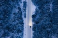 Aerial view of snowy road with cars, winter forest Royalty Free Stock Photo