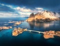 Aerial view of snowy rocks, islands, sea, bridge, cloudy sky Royalty Free Stock Photo