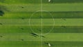 Aerial View of a Soccer Field with Training Equipment. Drone view of a soccer field with goalposts and a single ball at