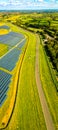 Aerial view of solar batteries field in english countryside Royalty Free Stock Photo