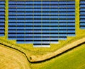 Aerial view of solar batteries field in english countryside Royalty Free Stock Photo