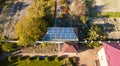 Aerial view of solar panals on the roof of small house