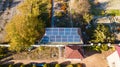 Aerial view of solar panals on the roof of small house