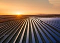 Aerial view on the solar panel. Technologies of renewable energy sources. View from air. Industrial landscape during sunset. Royalty Free Stock Photo