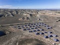 Aerial view of solar panels installed in a barren desert environment Royalty Free Stock Photo