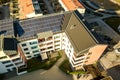 Aerial view of solar photovoltaic panels on a roof top of residential building block for producing clean electric energy. Royalty Free Stock Photo