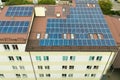 Aerial view of solar power plant with blue photovoltaic panels mounted of apartment building roof Royalty Free Stock Photo